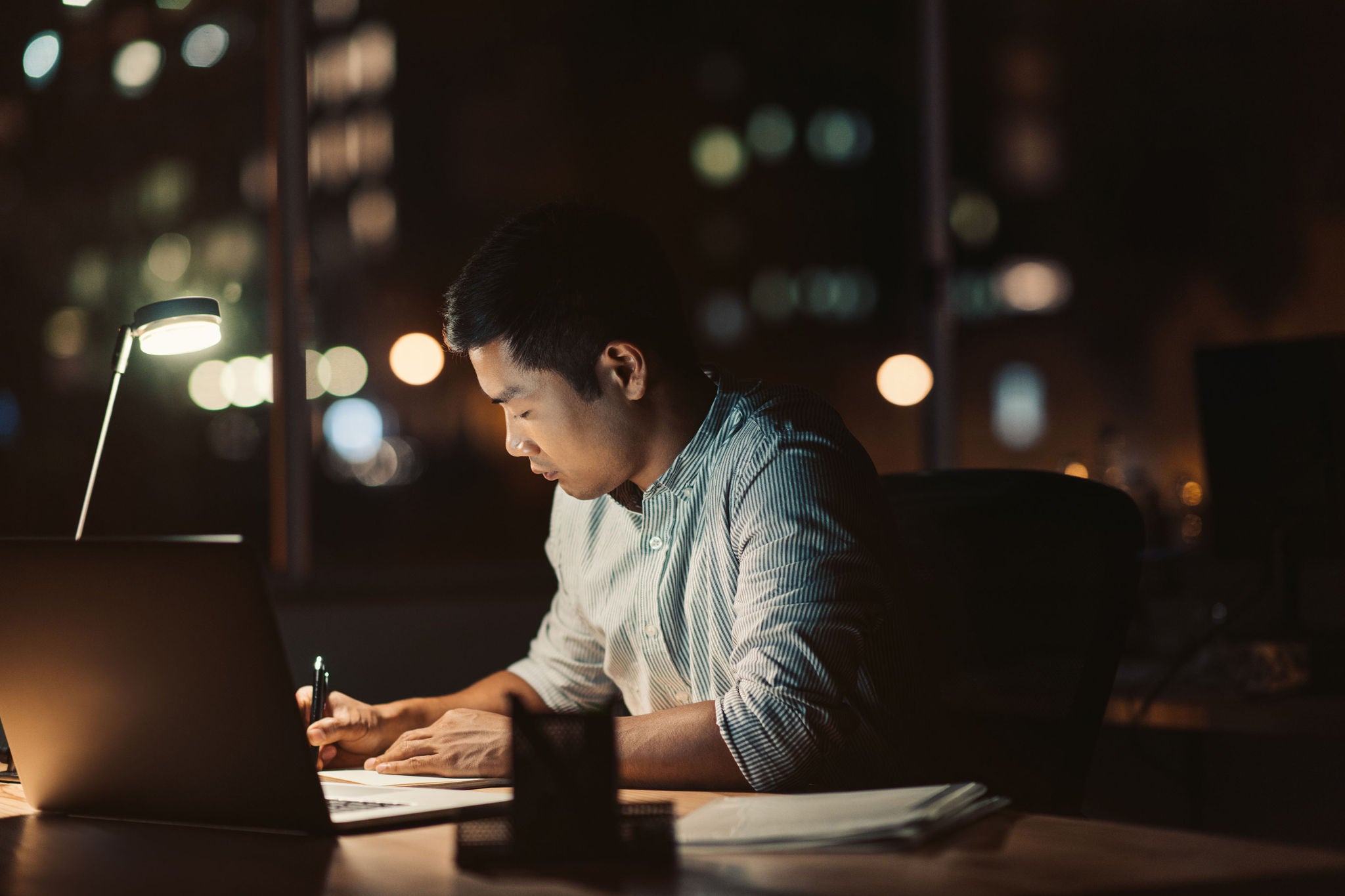 Businessman working at his desk late into the evening