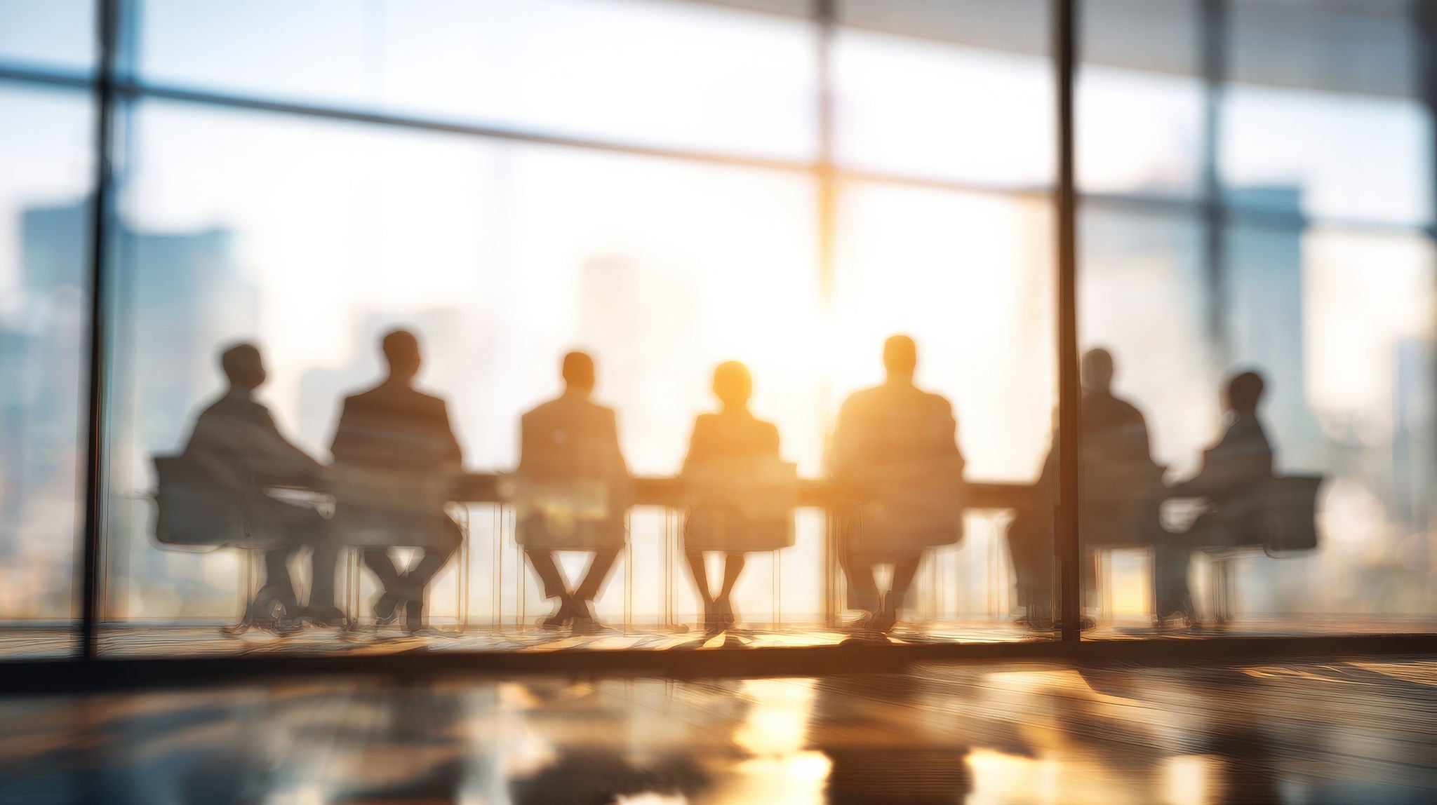 diverse executives table sitting. with blured businessbackground and natural sunlight --ar 16:9 --v 7 Job ID: 86b851ef-fd81-449f-8051-8d17b42be2c0