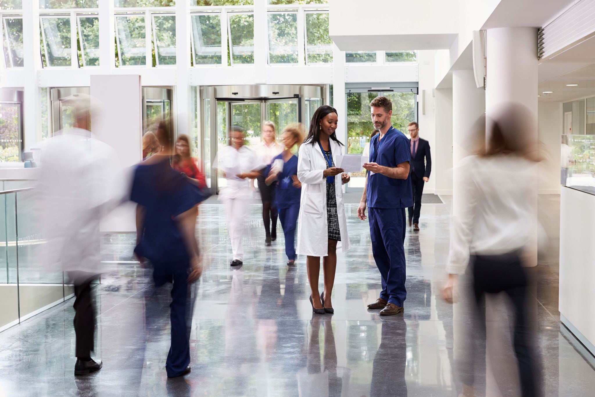 Cropped shot of diverse coworkers working together in boardroom