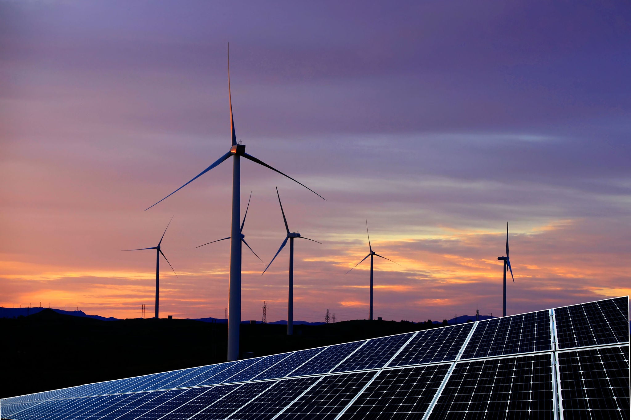 Solar photovoltaic panels and wind turbines. Energy concept