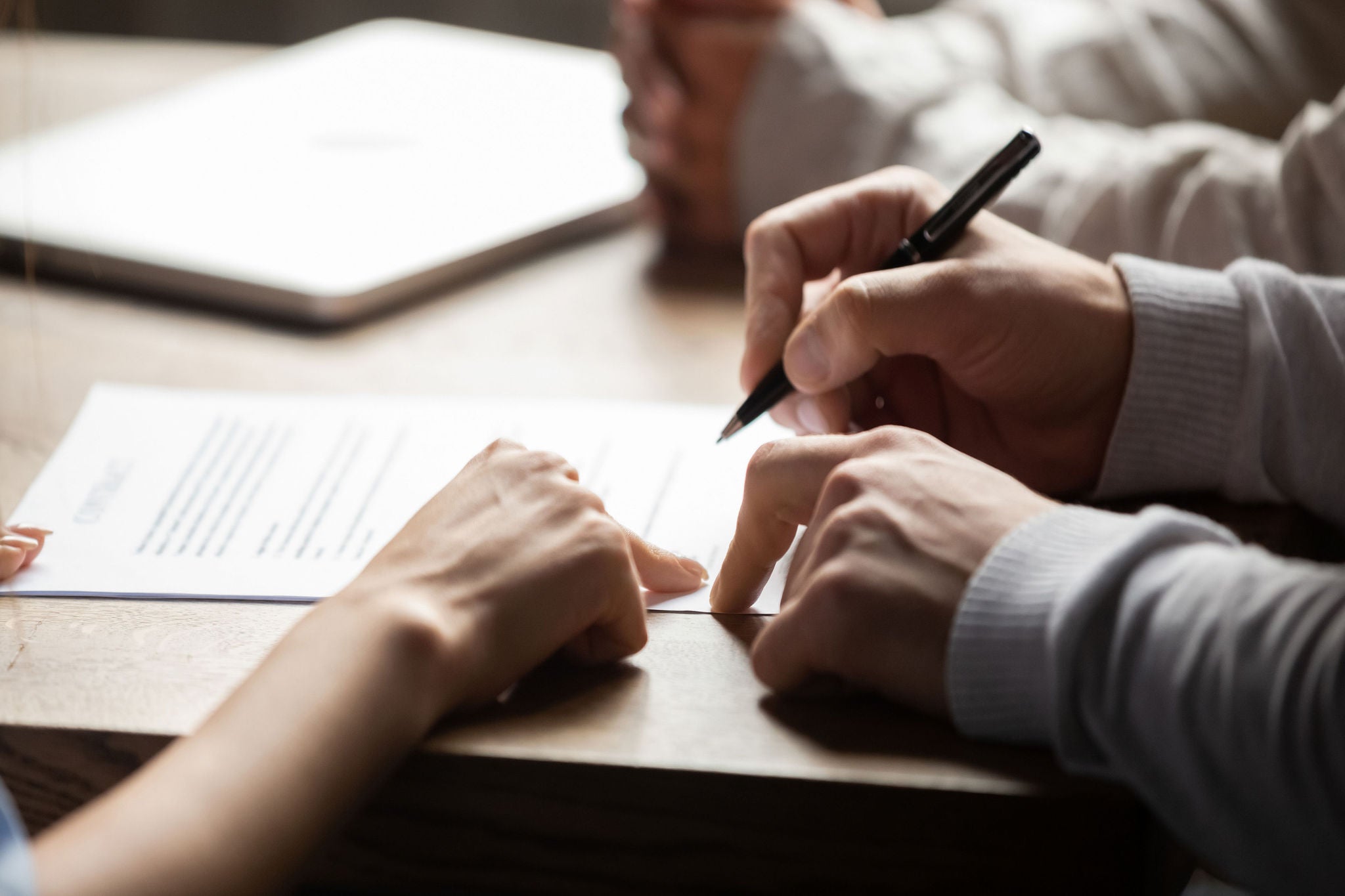 signing papers with a lawyer