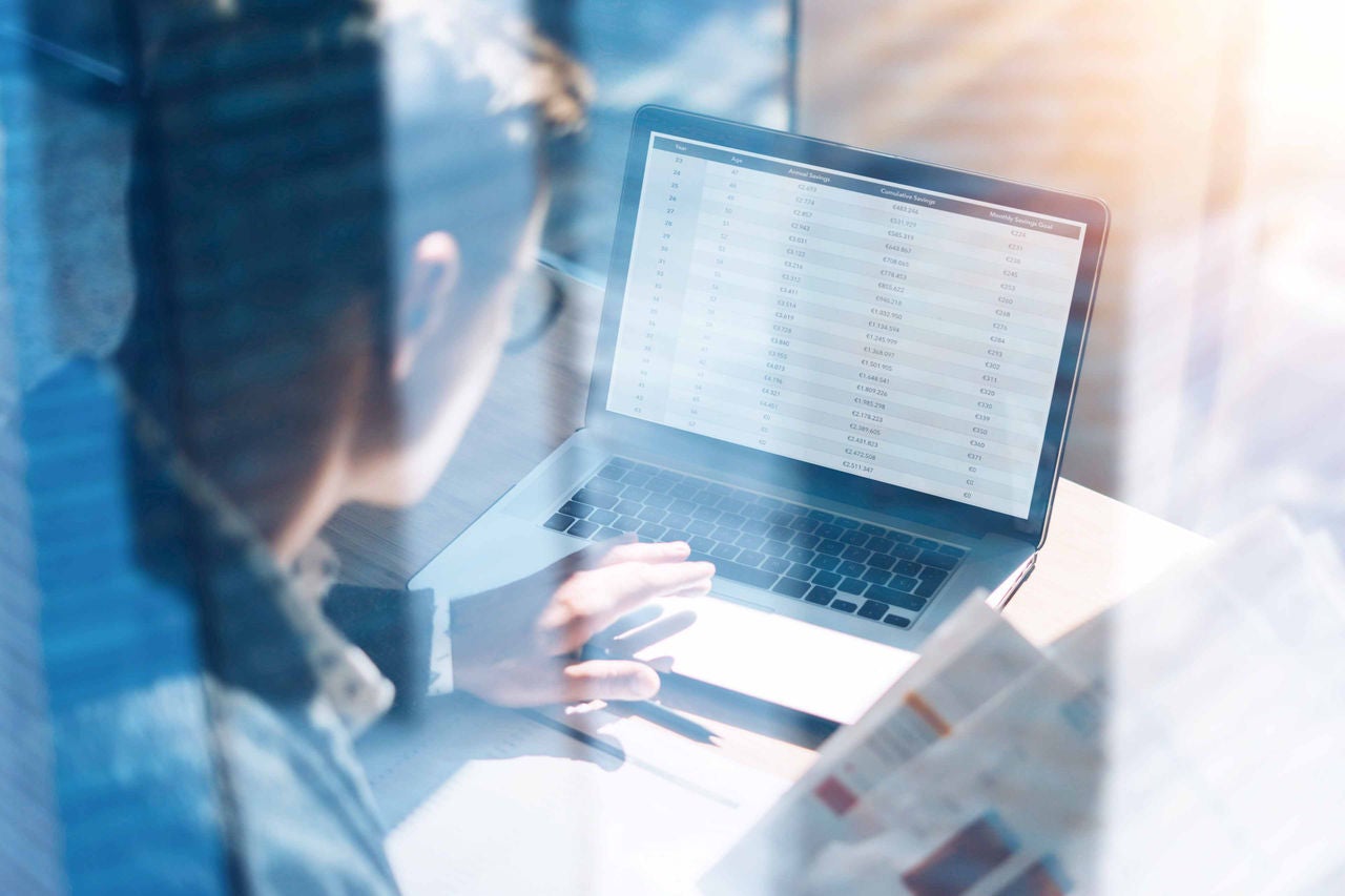 Closeup view of banking finance analyst in eyeglasses working