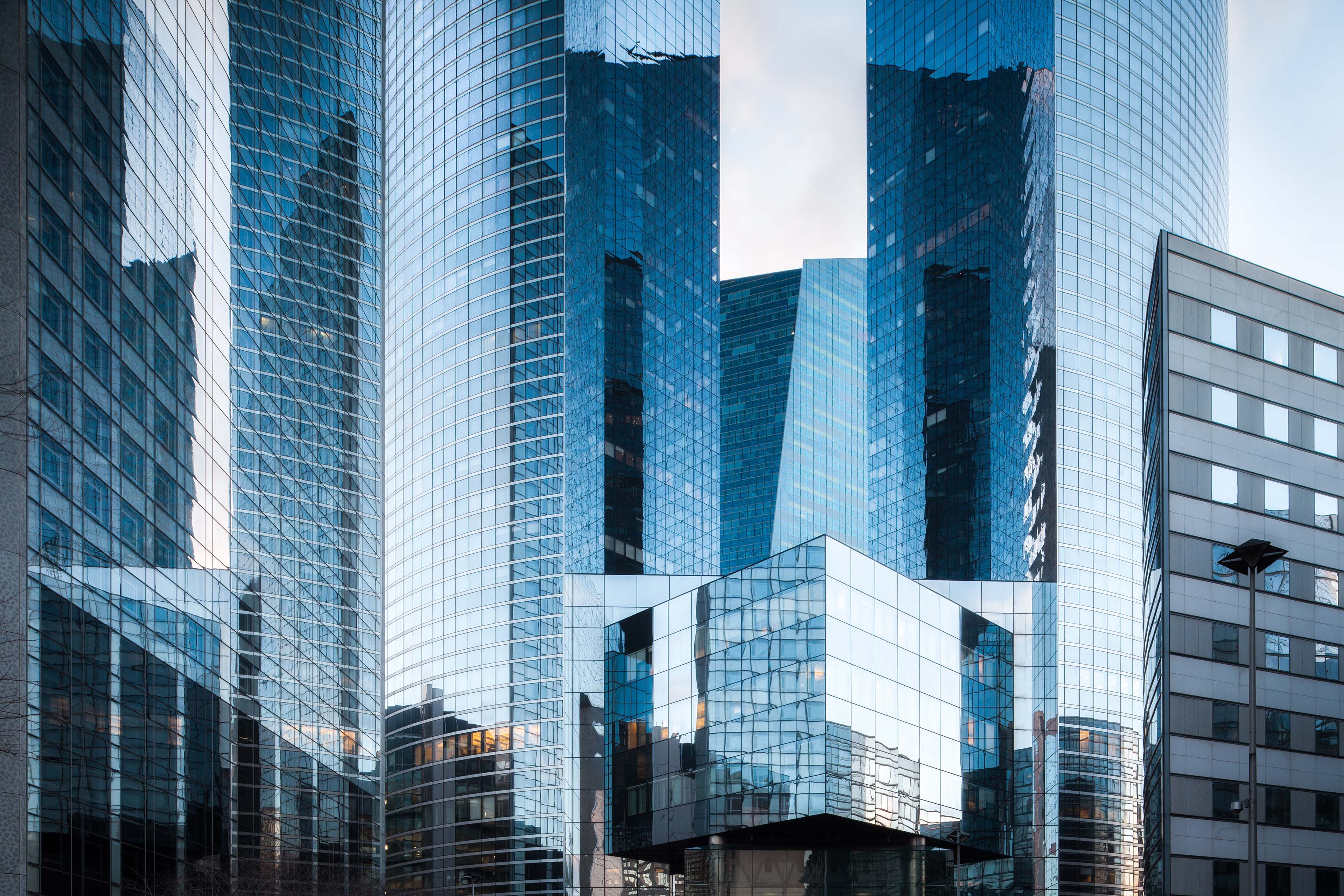 Sunset reflection in glass panels of modern building