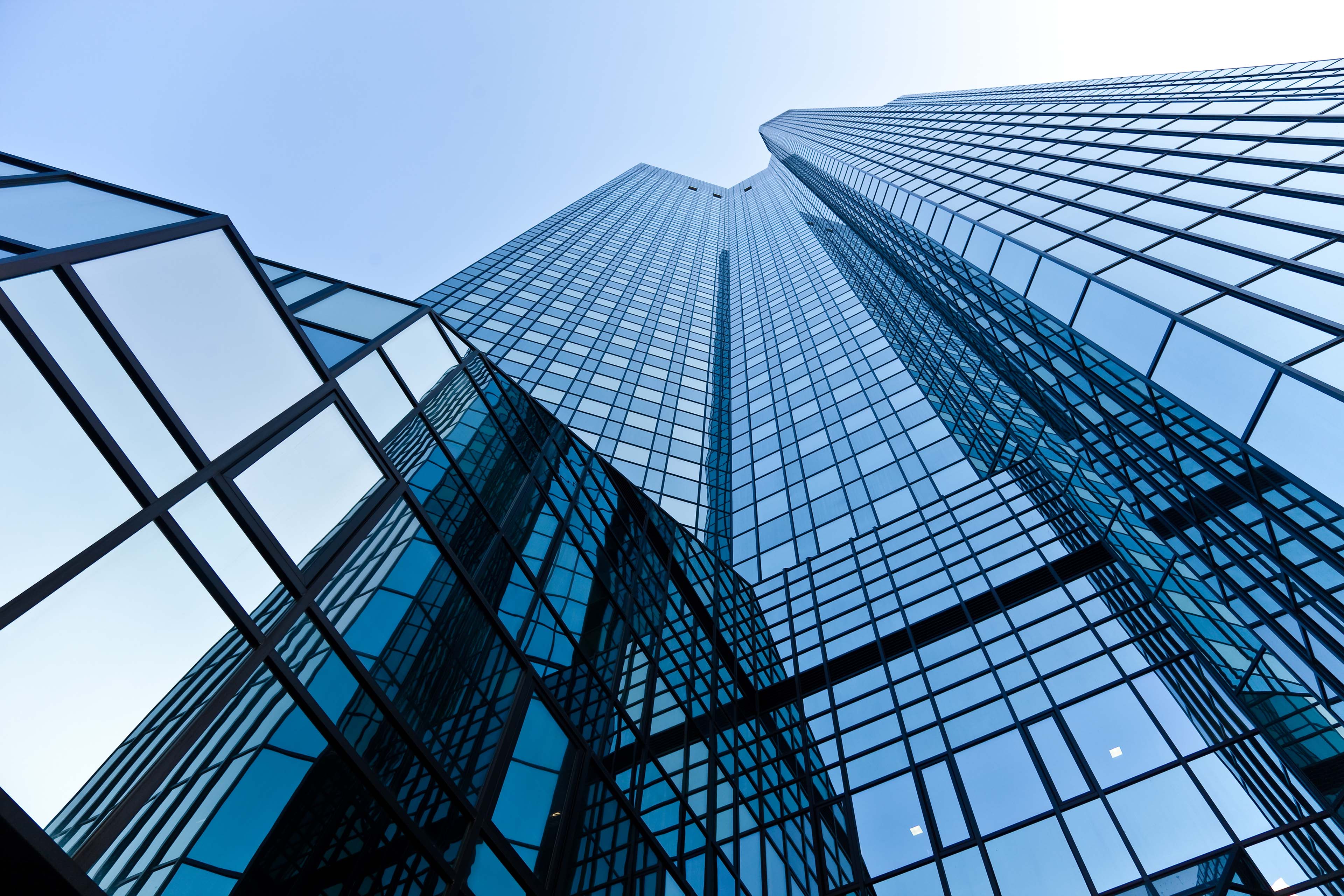 Sunset reflection in glass panels of modern building
