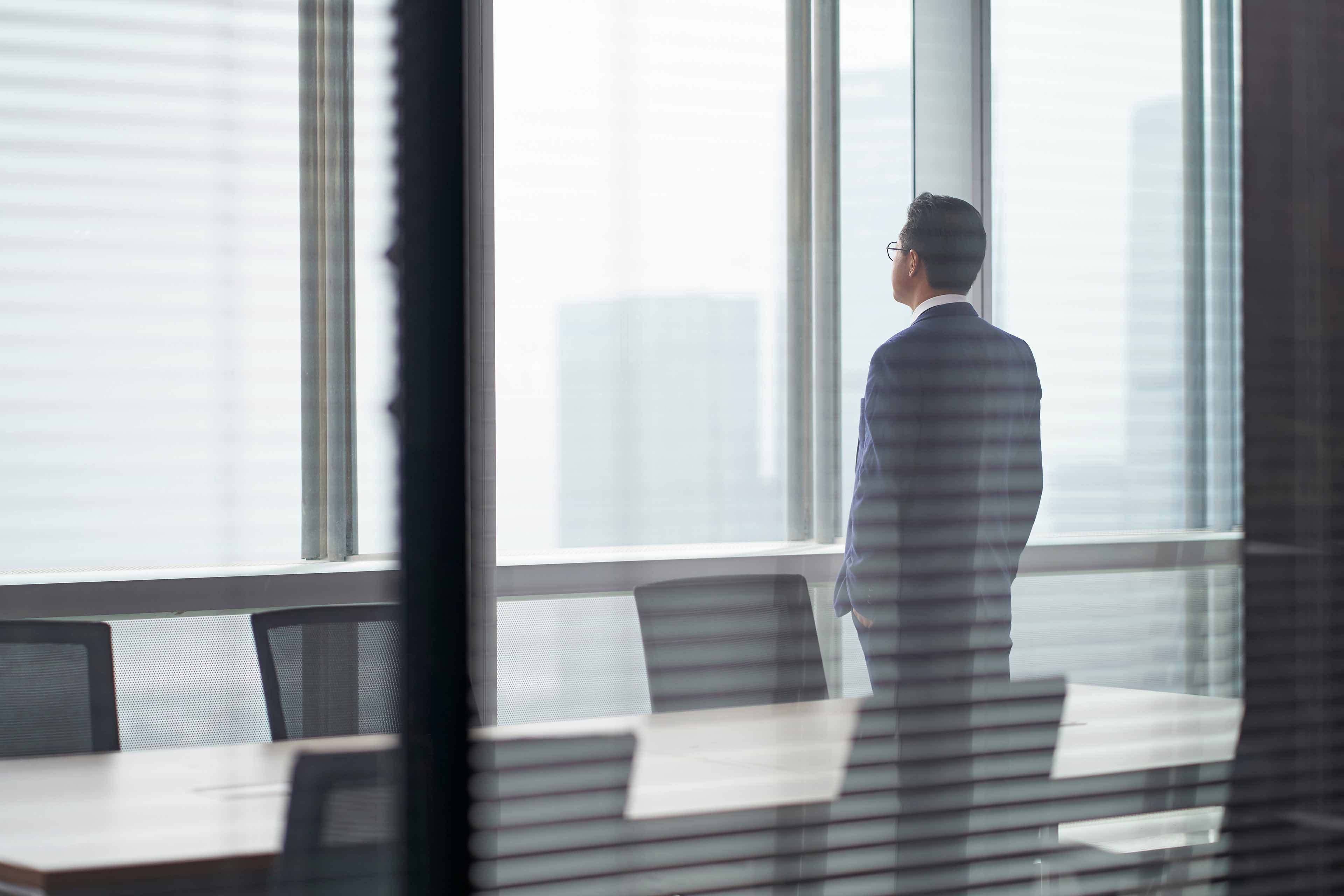 signing contract business agreement deal concept businessman signing official contract in modern office