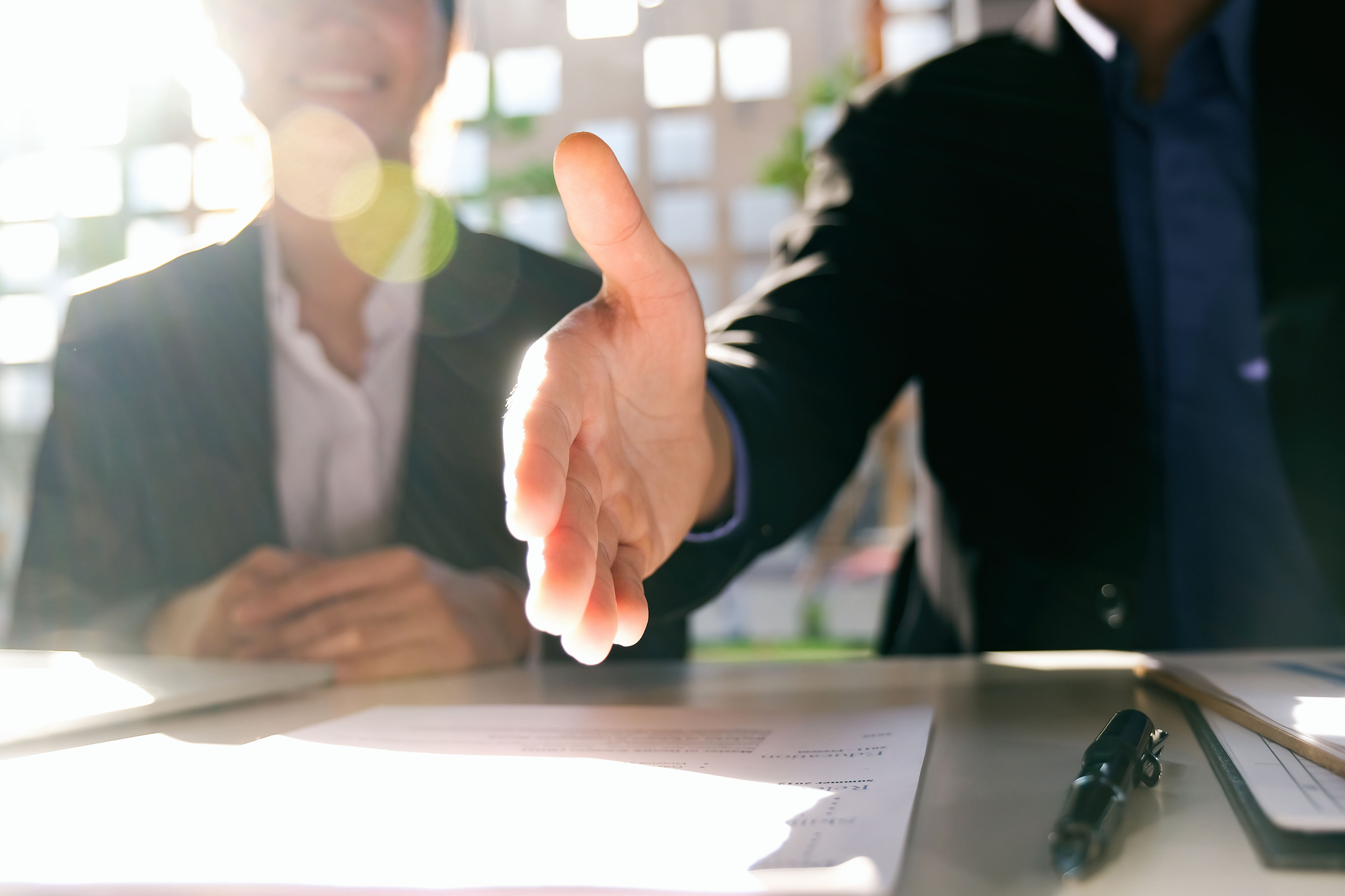 Welcome, business people and smile with handshake in office