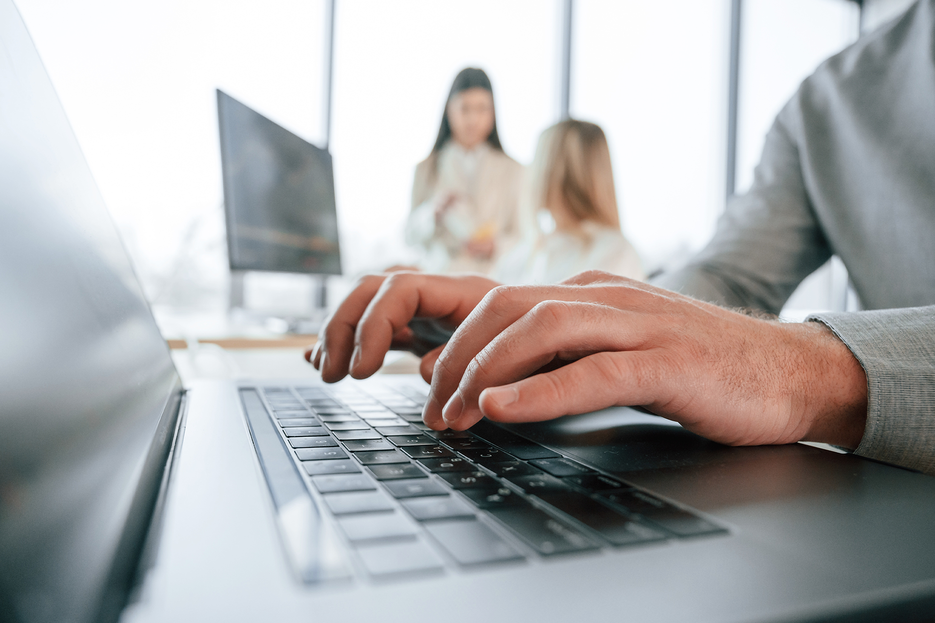A group of business professionals gathered in a boardroom
