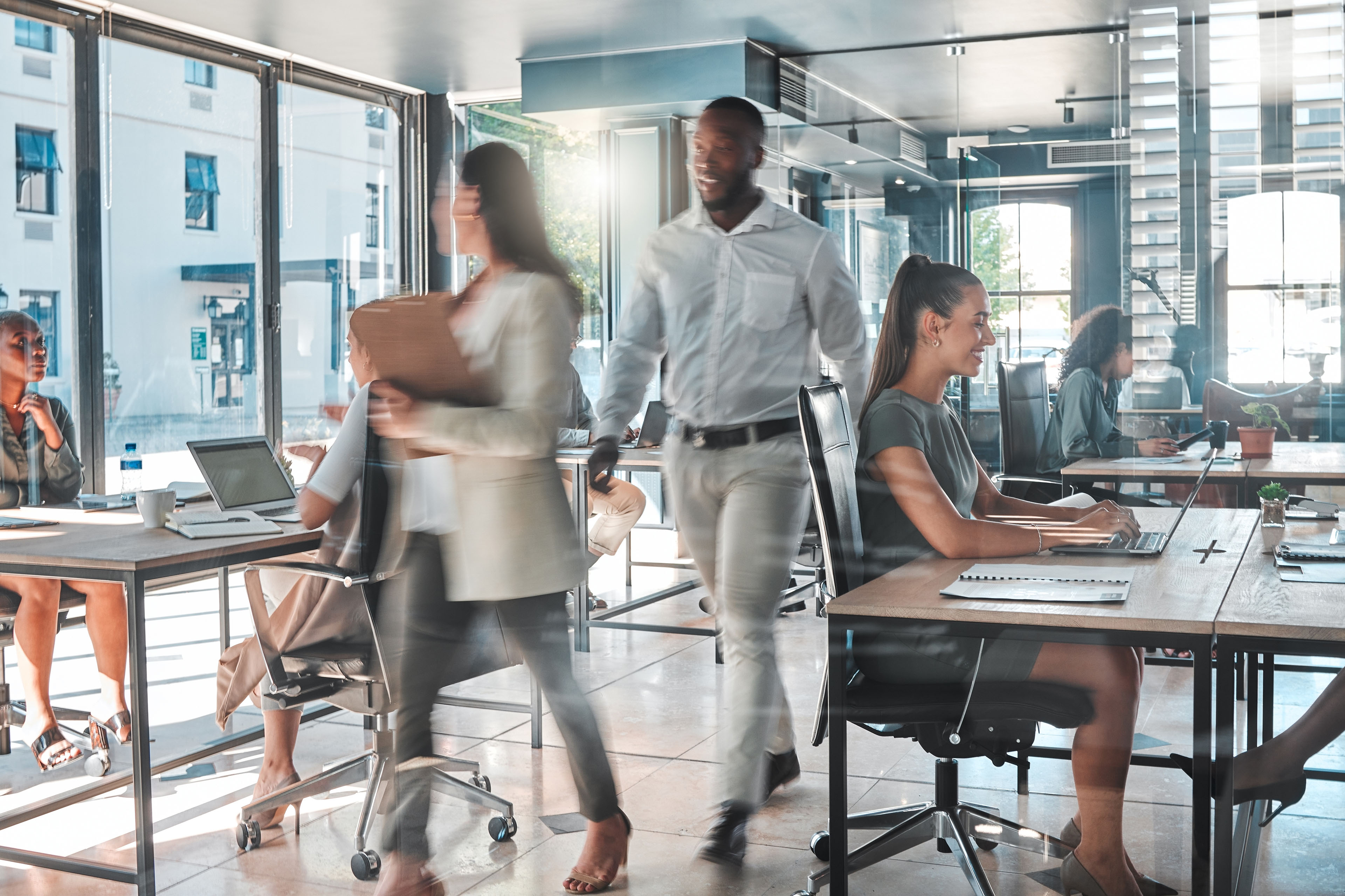 Busy office with a productive team of employees working hard and fast to complete tasks and projects