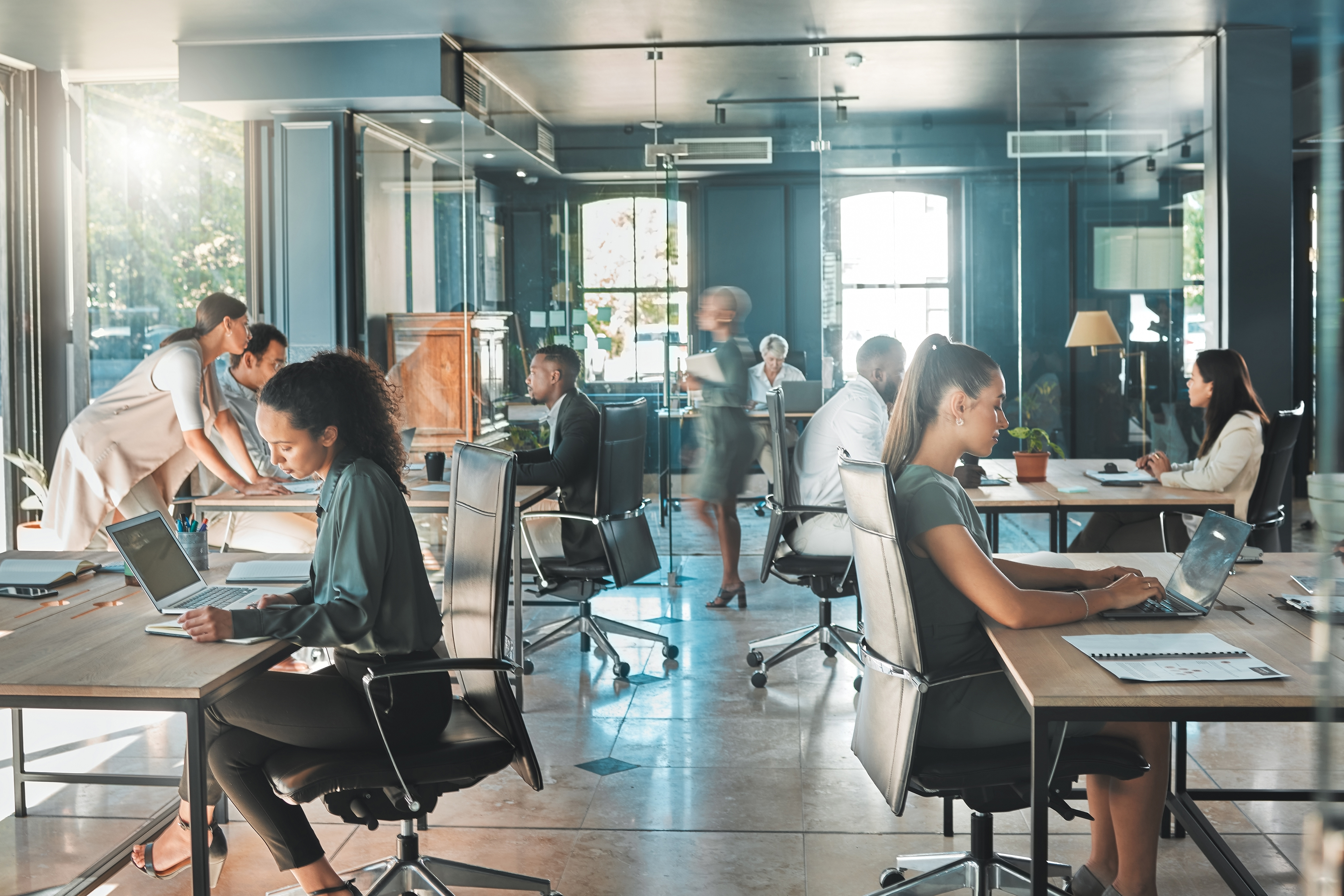 Corporate business people working in busy marketing office space
