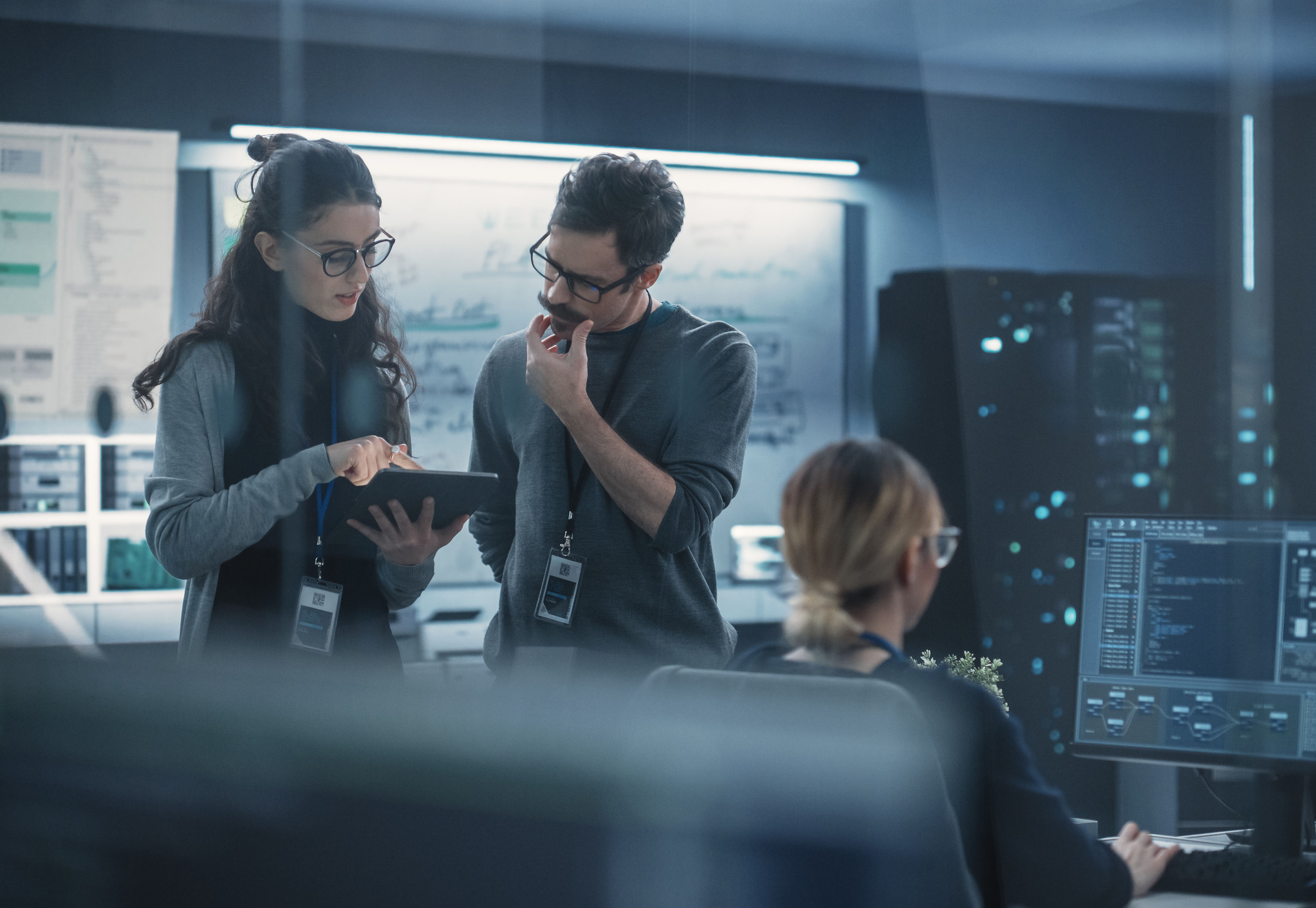 Portrait of Two Creative Young Female and Male Engineers Using Tablet